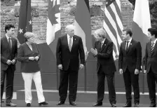  ?? REUTERS ?? ( From left) Canadian Prime Minister Justin Trudeau, German Chancellor Angela Merkel, US President Donald Trump, Italian Prime Minister Paolo Gentiloni, French President Emmanuel Macron, Japanese Prime Minister Shinzo Abe during the G7 Summit in Italy...