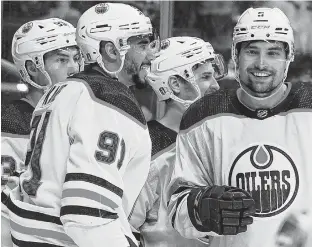  ?? KIRBY LEE • USA TODAY SPORTS ?? Edmonton Oilers left winger Evander Kane (91) and teammates celebrate a goal during their 8-2 trouncing of the LA Kings in Game 3 of their first-round Stanley Cup Playoffs series at Crypto.com Arena in Los Angeles on Friday. Kane netted a hat trick in the win that gave Edmonton a 2-1 series lead.