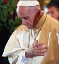  ?? DANIEL DAL ZENNARO — POOL PHOTO VIA AP ?? Pope Francis prays in the Wawel Cathedral in Krakow, Poland, Wednesday. Pope Francis has prayed by the relics of the late pope from Poland, St. John Paul II, at the and has met with Poland’s bishops who vowed to “listen carefully” to his teaching.