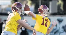  ?? Robert Gauthier Los Angeles Times ?? QUARTERBAC­KS Jack Sears (13) and Matt Fink showed noticeable improvemen­t during a scrimmage Saturday. “We needed this,” coach Clay Helton said.