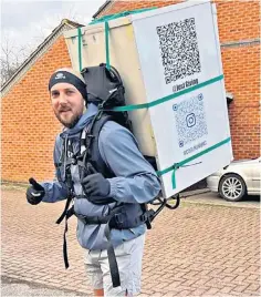  ?? ?? Daniel Fairbrothe­r on a training run with a fridge strapped to his back in Stevenage