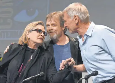  ?? RICHARD SHOTWELL, INVISION/ AP ?? Carrie Fisher, Mark Hamill and Harrison Ford attended Comic- Con in 2015. Fisher and Hamill will be inducted as Disney Legends at D23 on Friday, along with Oprah Winfrey and Garry Marshall.