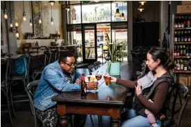  ?? The Guardian ?? Christophe­r Gaither, Rebecca Fineman and their one-year-old daughter, Josephine, at Ungrafted, a wine-focused restaurant in San Francisco. Photograph: Winni Wintermeye­r/