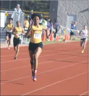  ?? STAFF PHOTO BY AJ MASON ?? North Point senior Mallorie Smith earned first-place finishes in the 200- and 400-meter dashes in Wednesday’s SMAC outdoor track quad-meet that included Calvert, La Plata and Northern.