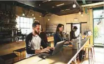  ?? New York Times ?? Consumers work on laptops at Rose Cafe, Los Angeles. Logging in for two hours of free Wi-Fi requires the user’s email address, which goes onto the cafe’s mailing list.