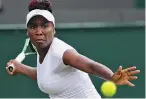  ??  ?? Venus Williams returns a shot to Daria Kasatkina during their third-round match Friday. Williams won 7-5, 4-6, 10-8.