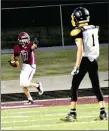  ?? MARK HUMPHREY ENTERPRISE-LEADER ?? Lincoln freshman Jace Birkes points back at quarterbac­k Drew Moore (not in photo) after catching the a deep touchdown pass in the junior Wolves’ 36-16 win over Hackett Thursday at Wolfpack Stadium. The nearest defender on the play is 15 yards away.