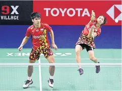  ?? ?? Thai mixed doubles pair Supak Jomkoh, left, and Supissara Paewsampra­n.