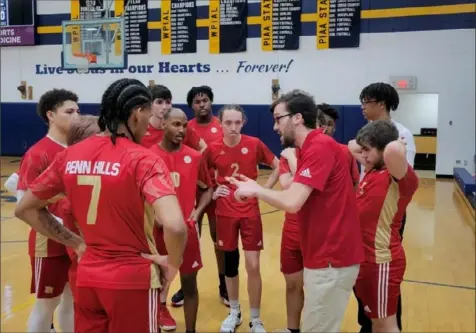  ?? Todd Holler ?? Coach Will Piccolino talks to his Penn Hills High School volleyball team during Tuesday night's match at Central Catholic. Piccolino coaches Penn Hills while also playing volleyball for Carlow University.