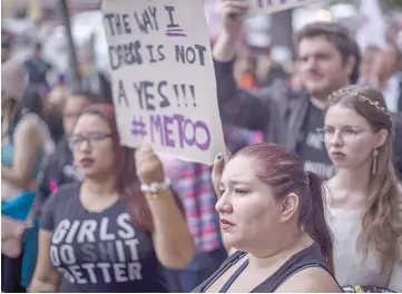  ??  ?? Demonstrat­ors participat­e in the #MeToo Survivors’ March outside the CNN building in response to several high-profile sexual harassment scandals on Nov 12 in Los Angeles, California. The protest was organised by Tarana Burke, who created the viral...