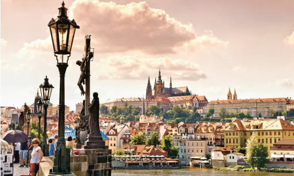  ?? DOMINIC ARIZONA BONUCCELLI ?? For more than a thousand years, Czech leaders have ruled from Prague Castle, regally perched on a hill above the Vltava River.