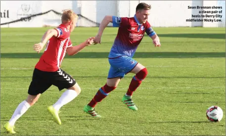  ??  ?? Sean Brennan shows a clean pair of heels to Derry City midfielder Nicky Low.