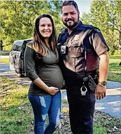 ?? COURTESY ?? Lauren Wells, a registered nurse, and her husband, Chattahooc­hee Hills police officer Cpl. Joe Wells, helped save a man and woman stranded last month on a country road in their truck.