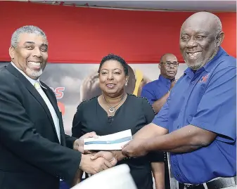  ?? RUDOLPH BROWN ?? Leon Mitchell (left) assistant general manager of JN Group, presents a cheque to Glen Mills (right), President of Racers Track Club, while Sports Minister Olivia ‘Babsy’Grange looks on at the Racers Grand Prix launch at The Jamaica Pegasus hotel...