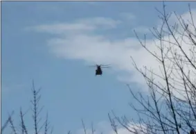  ?? CHARLES PRITCHARD — ONEIDA DAILY DISPATCH ?? A CH-47Chinook helicopter piloted by a Civil Support Strike Team makes its way to the Hamilton College rugby field as part of an emergency response exercise on Monday, March 18, 2019.