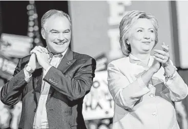  ?? Melina Mara / Washington Post ?? Democratic presidenti­al candidate Hillary Clinton presents her running mate, Virginia Sen. Tim Kaine, on Saturday at a rally at Florida Internatio­nal University Panther Arena in Miami. Clinton pointed out their similariti­es with Kaine highlighti­ng one...