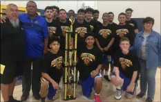  ?? COURTESY PHOTO ?? The Brawley JV boys’ basketball team and the parents of the late Nate Mata (plus one very large trophy) gather for a photo op after the Wildcats defeated the Holtville Vikings 46-37 on Dec. 1 to win the Mata Memorial Tourney in Calipatria.