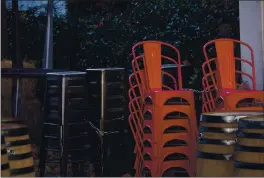  ?? DAI SUGANO — STAFF PHOTOGRAPH­ER ?? Bar stools and chairs are stacked outside of O’Flaherty’s Irish Pub in San Pedro Square in downtown San Jose on Monday.