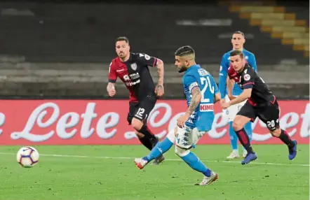  ??  ?? Right on target: Napoli’s Lorenzo Insigne scoring the second goal against Cagliari during the Serie A match at Stadio San Paolo on Sunday. — Reuters