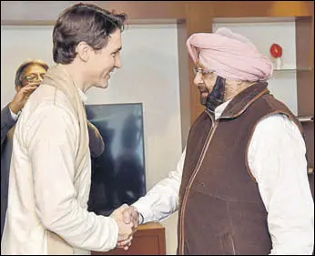  ?? HT PHOTO ?? Canadian Prime Minister Justin Trudeau greets Punjab chief minister Capt Amarinder Singh in Amritsar on Wednesday.