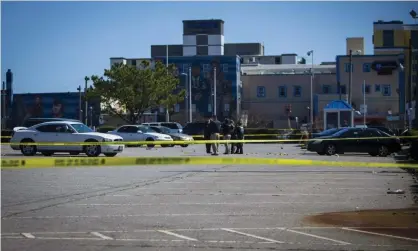  ??  ?? Virginia Beach police at the scene of a shooting that occurred the previous night in Virginia on 27 March. Photograph: John C Clark/AP