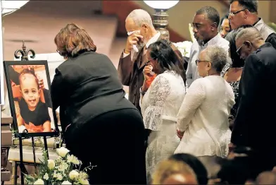  ??  ?? FAREWELL: Friends and relatives share their grief Saturday for tragic members of the Coleman family, Horace, Belinda, Irvin, Angela and Maxwell, in Indianapol­is. They drowned in a Missouri duck boat capsizing on July 19.