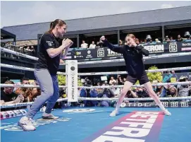  ?? Niall Carson/Associated Press ?? Katie Taylor, left, spars with Carly Burke in Dublin, Ireland, on Wednesday ahead of Saturday’s lightweigh­t championsh­ip fight against Chantelle Cameron.