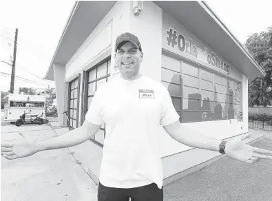  ?? STEPHEN M. DOWELL/ORLANDO SENTINEL ?? Thomas Ward stands by the building that will become a new pizzeria on Mills Avenue in Orlando. The new pizzeria will be influenced by his popular restaurant Pig Floyd’s just down the street.