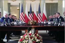  ?? EVAN VUCCI — THE ASSOCIATED PRESS ?? President Joe Biden, left, and Polish President Andrzej Duda, right, meet Tuesday, Feb. 21, 2023, in Warsaw.