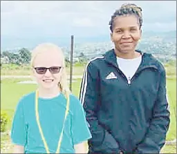  ?? ?? ESA Secretary General Nozipho Mahlalela (R) posing with Sharks Swimming Club’s Nora Kay from the USA during the swimming gala on Saturday.