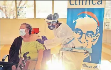  ?? Genaro Molina Los Angeles Times ?? ANA CANALES, 78, receives the COVID-19 vaccine developed by Moderna from medical assistant Licelda Perez at Clínica Romero’s vaccinatio­n clinic for patients 75 and older in L.A.’s Boyle Heights neighborho­od.