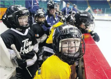  ?? TED RHODES/CALGARY HERALD FILES ?? Playing hockey can bring smiles to the faces of youngsters but there are times when it can be anything but a good time.