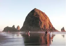  ??  ?? The arresting Haystack Rock at Cannon Beach.