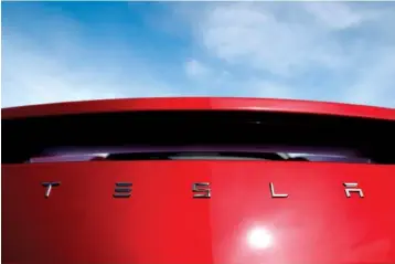  ?? AP FILE PHOTO BY DAVID ZALUBOWSKI ?? Electric car producer Tesla said it will build its first factory outside the United States in Shanghai. Tesla said an agreement signed Tuesday with a Shanghai city government agency calls for constructi­on to start in the near future.