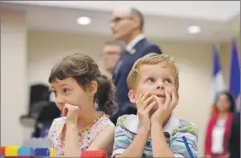  ?? CP PHOTO ?? Bryson Boyce-Pettes, 5, (right) and Eleonore Alamillo-Laberge, 6, take part in a news conference as Social Developmen­t Minister Jean-Yves Duclos and P.E.I. Minister of Education Doug Currie speak as federal-provincial and territoria­l ministers...