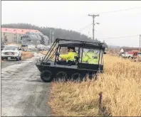  ??  ?? Royal Newfoundla­nd Constabula­ry officers and searchers head into a wooded area with shovels to do some secondary work at Bellevue Beach searching for any possible clues into the disappeara­nce of Cortney Lake. RNC police officers and ground searchers...