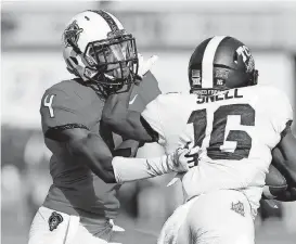  ?? [PHOTO BY SARAH PHIPPS, THE OKLAHOMAN] ?? Oklahoma State cornerback A.J. Green tries to tackle TCU’s Kenedy Snell last week at Boone Pickens Stadium in Stillwater.