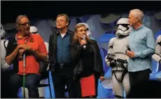  ?? TISH WELLS/MCCLATCHY D.C. FILE PHOTOGRAPH ?? From the classic Star Wars Trilogy, Peter Mayhew (Chewbacca), Mark Hamill (Luke Skywalker), Carrie Fisher (Princess Leia) and Anthony Daniels (C-3PO) during the opening ceremony of the Star Wars at the Anaheim Convention Center in Anaheim on April 16,...