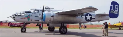  ??  ?? Bottom: The B-25 bomber on the ground in Medicine Hat Monday just before a flight for local media and a Second World War veteran. Flights are available for the public this week.