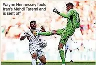  ?? ?? Wayne Hennessey fouls Iran’s Mehdi Taremi and is sent off