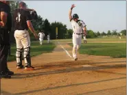  ?? MIKE CABREY — MEDIANEWS GROUP ?? Skippack’s Rob Zinsmeiste­r (5) scores a run during Game 3 of the Lumberjack­s’ Perky League semifinal series against Collegevil­le Wednesday at Palmer Park.