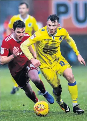  ??  ?? Bristol Rovers’ Ollie Clarke goes past Accrington’s Sam Finley