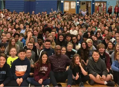  ?? MICHAEL GWIZDALA - MEDIANEWS GROUP ?? Tay ‘Firefly’ Fisher sits with students at Goff Middle School in East Greenbush, Wednesday morning.