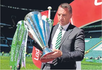  ?? SNS. ?? Seventh heaven: Celtic boss Brendan Rodgers with the Ladbrokes Premiershi­p trophy.