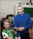  ??  ?? Seamie Byrne presents the James Byrne Memorial Cup to Stephen Patterson.