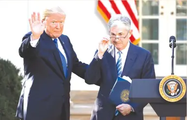  ?? (Carlos Barria/Reuters) ?? US PRESIDENT Donald Trump introduces Jerome Powell, chairman of the US Federal Reserve, at the White House in 2017. Trump’s demands that the Fed stimulate the economy, by contrast, have covered a gamut of immediate needs, and moved well beyond convention to suggest, for example, that the Fed restart crisis-era asset purchases at a time of historical­ly low unemployme­nt.