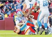  ?? DARRYL SMITH/TNS ?? Lions quarterbac­k Jeff Driskel is sacked during the first half against the Redskins on Sunday.