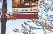  ?? ROBERT FRANKLIN/ SOUTH BEND TRIBUNE ?? Signs on light poles in downtown Buchanan on May 12, 2021.