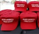  ?? Rogelio V. Solis/Associated Press ?? A set of "Make America Great Again" hats await purchase on Nov. 1 outside an arena in Tupelo, Miss.