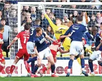  ?? ?? SUPER SAVER Boro keeper Lumley brilliantl­y denies Cooper MILLWALL: Bialkowski 7; Ballard 8, Cooper 8, M Wallace 8; Mcnamara 7, Saville 7, Mitchell 7, Malone 8; J Wallace 7, Afobe 7, Bennett 6 (Lovelace 70).
Long, Pearce, Mahoney, Evans, Burey, Muller.
Lumley 7; Mcnair 8, Fry 7, Peltier 8; Jones 7, Howson 8, Tavernier 9, Taylor 7; Crooks 6, Connolly 7 (Watmore 74), Balogun 7.
Daniels, Wood, Bamba, Bola, Coburn, Boyd-munce.
Marcus Tavernier. Silk and steel in the middle of the park. Robert Jones 6.